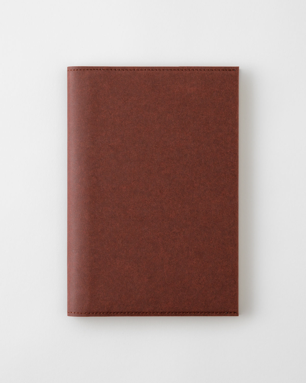 Closed MD Notebook Cover [A5] Paper Hard in brown shown on a white background.