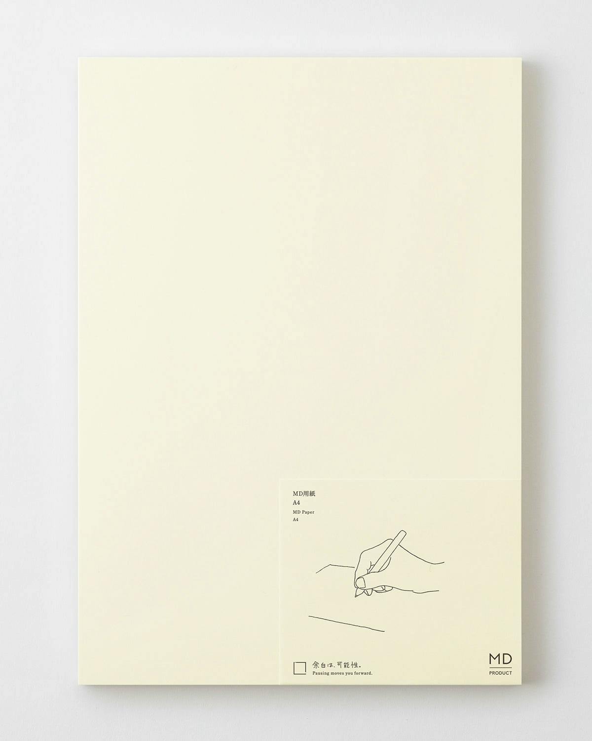 A pad of MD paper (notebook) shown from above with a small product label visible in the lower-right corner.