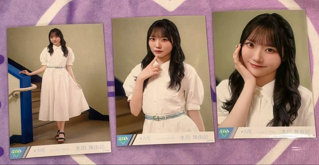 Three printed photos of 本田珠由記 from the 'Summer haze' set arranged side-by-side on a purple cloth.