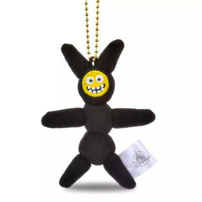 Black Baymax mini plush keychain with long ears, a yellow smiling face, and an attached gold ball chain.