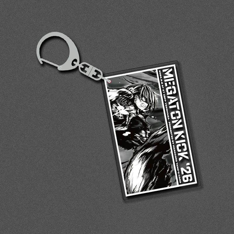 Rectangular acrylic keychain showing a black-and-white illustrated character and the text “MEGATON KICK '26,” attached to a metal key ring on a gray background.