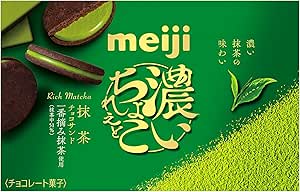 Green Meiji packaging for matcha chocolate sand cookies showing two cookie pieces and a bed of matcha powder graphics.