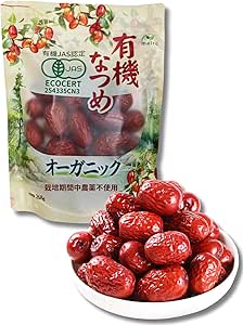 A packaged bag of organic jujube dates with a white bowl of red dried jujubes in front.