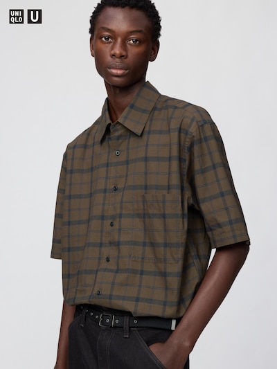 Male model wearing a short-sleeve checked button-down men's cotton shirt.