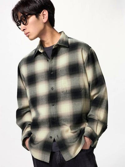 Male model wearing the men's flannel ombre-check shirt in light and dark tones, shown front view.