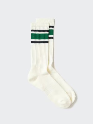 White men's cotton socks with green and black horizontal stripes at the cuff shown on a light background.