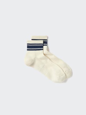 A pair of men's off-white socks with navy double stripes at the cuff photographed on a light background.