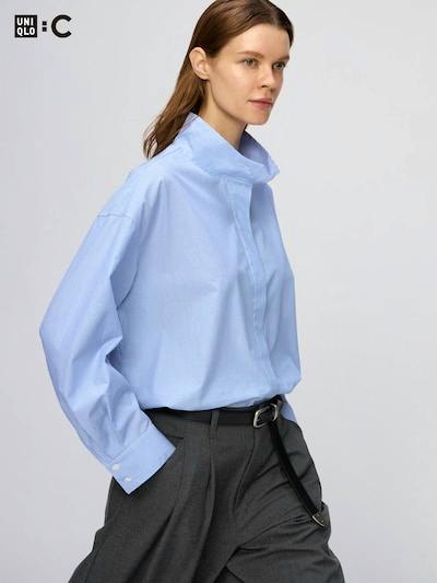 Light blue cotton stand-collar men's shirt worn by a model in a three-quarter pose.