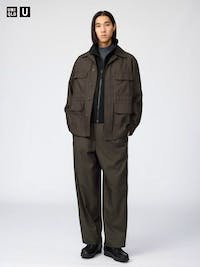 Male model wearing the men's polyester easy wide pants, full-length front view.