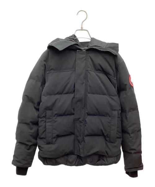 Front view of a men's black MacMillan down parka jacket hanging on a hanger against a white background.