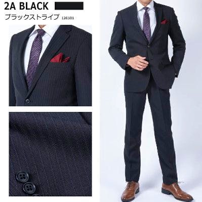 Male model wearing a dark pinstripe slim men's suit jacket and matching trousers, with fabric close-up and button detail.