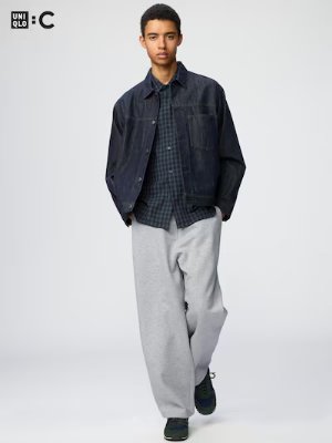 Male model wearing grey Wide Sweatpants (men's pants) styled with a jacket and shirt.