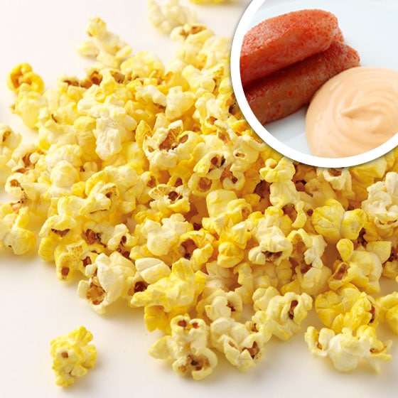 A pile of popcorn with an inset close-up showing mentaiko (pollock roe) and mayonnaise to indicate the flavor.