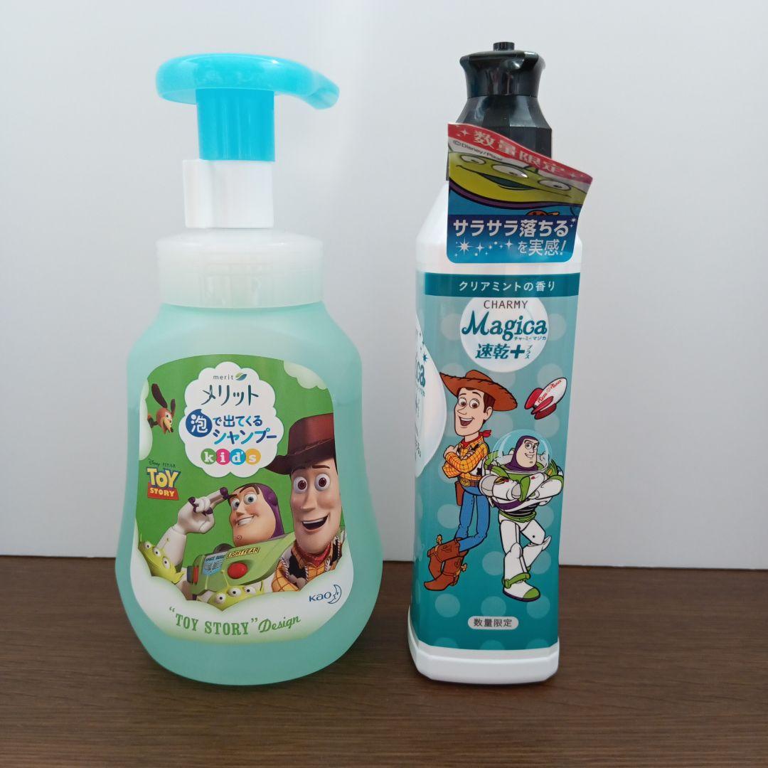 Front view of the Merit foaming kids' shampoo bottle with Toy Story characters shown beside a Charmy Magica bottle.