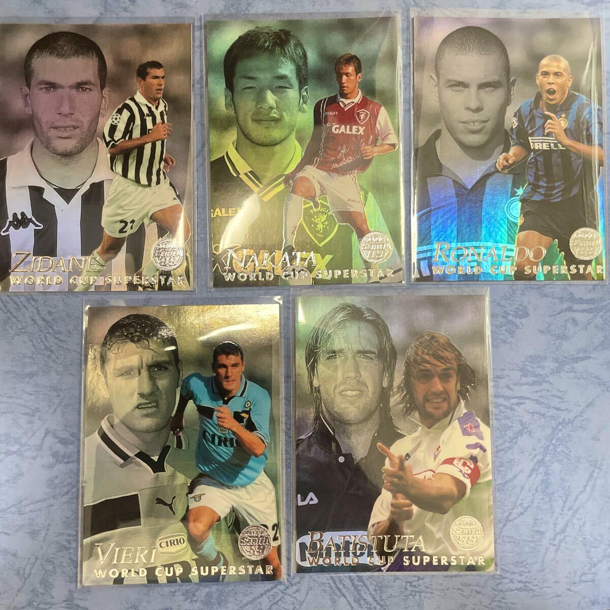 Five Merlin Serie A 99 World Cup Superstar photocard set showing Zidane, Nakata, Ronaldo, Vieri, and Batistuta arranged on a blue surface.