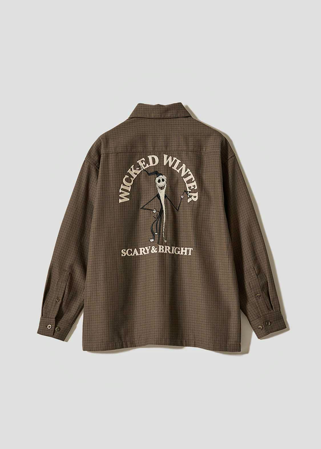 Back view of a brown checked women's big-silhouette shirt with long sleeves and a large back graphic reading "WICKED WINTER" and "SCARY & BRIGHT" around a character.
