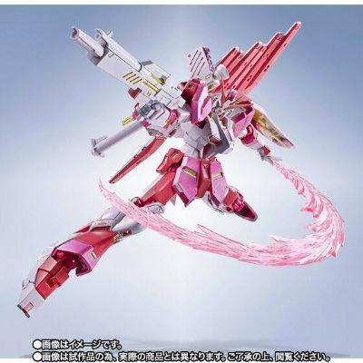 A pink-and-white METAL ROBOT SPIRITS ν Gundam Sakura Miko ver. figure posed dynamically with a translucent pink energy effect part.
