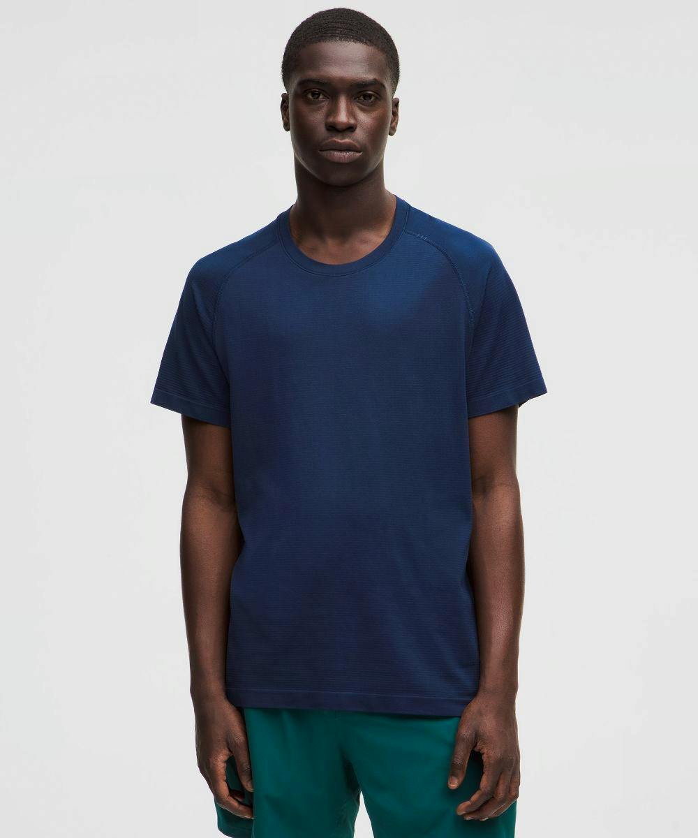 Front view of a man wearing a navy Metal Vent Tech short‑sleeve men's nylon shirt.