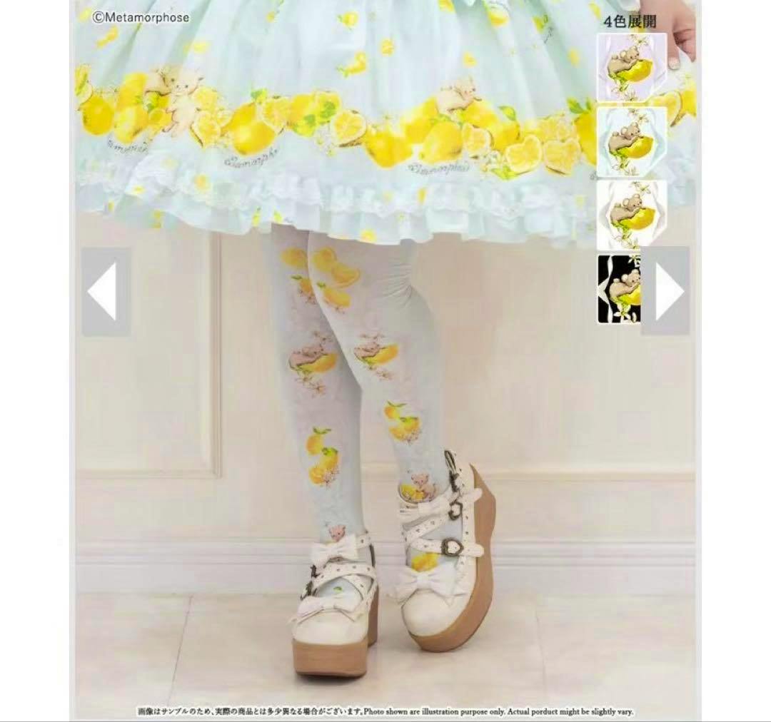 Legs wearing mint over-knee socks with lemon and bear print, shown under a skirt and paired with platform shoes.