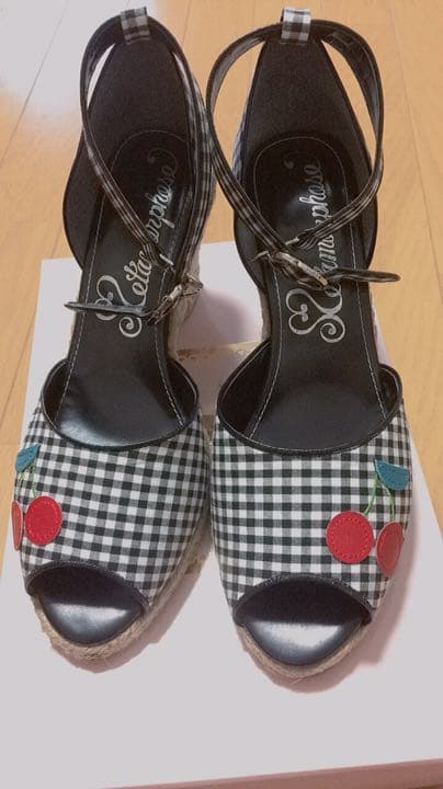 Top-down view of Metamorphose gingham-check cherry sandals with ankle straps and peep toes.
