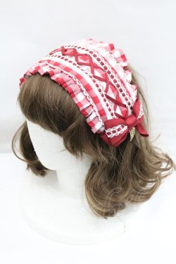 Red and white gingham headband displayed on a white mannequin head.