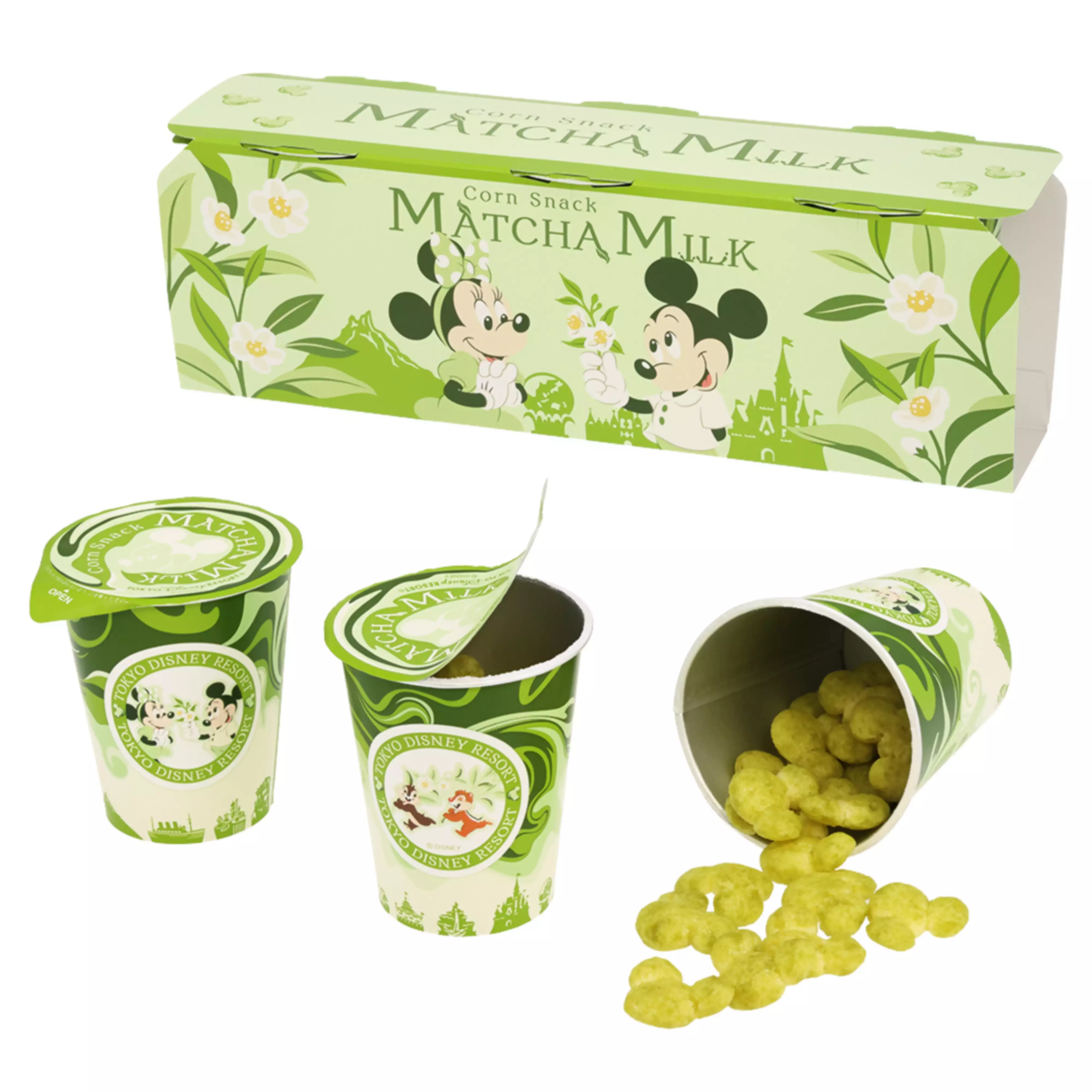 A paper box and three paper cups with Mickey and Minnie artwork labeled Matcha Milk, one cup opened showing green corn snacks spilling out.