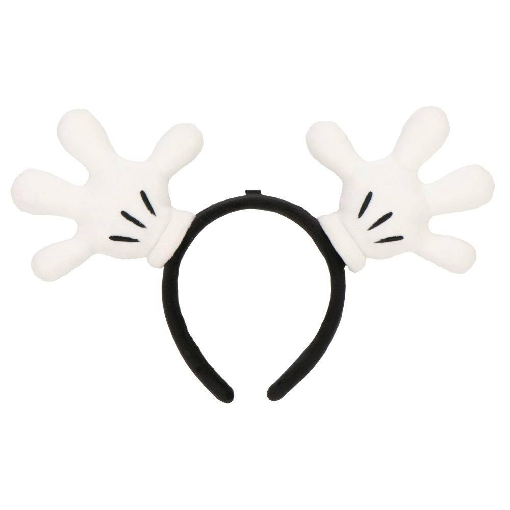 Black headband with two white Mickey Mouse glove-shaped decorations attached.