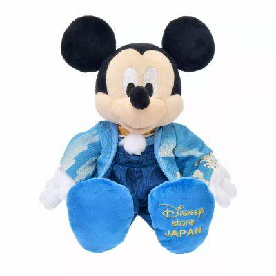 A Mickey Mouse plush wearing a blue kimono with "Disney store JAPAN" embroidered on its foot.