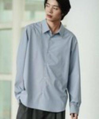 Model wearing the MICRO SPAN BASIC SHIRT, a light-colored long-sleeve men's polyester shirt.