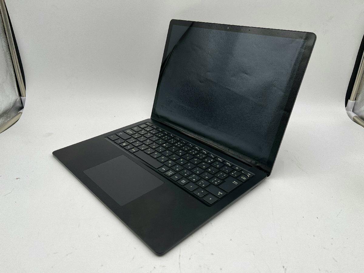 Microsoft Surface Laptop 4 open at an angle showing the keyboard, trackpad, and dark screen.