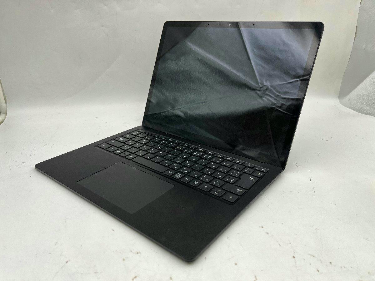 Microsoft Surface Laptop 5 open at an angle showing the keyboard, trackpad, and dark screen.