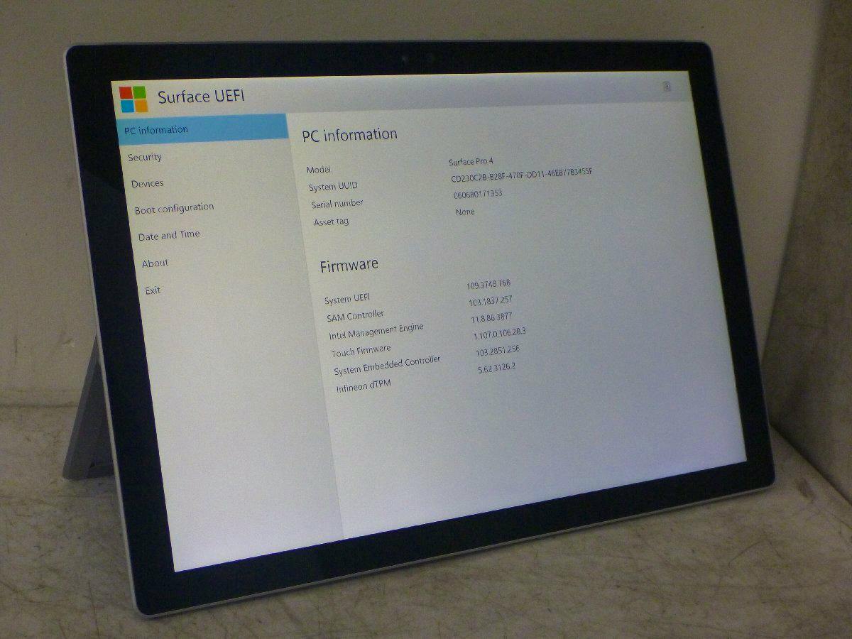 Microsoft Surface Pro 4 tablet on its kickstand displaying the Surface UEFI PC information screen.