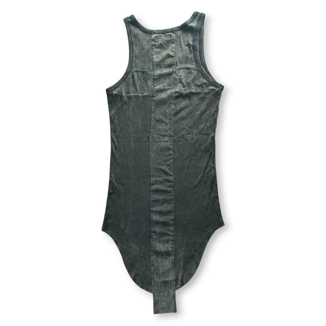 Back view of a cotton tank top laid flat showing a central back panel and an extended lower strap.