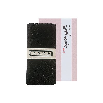 A stack of dried sushi seaweed (nori) sheets displayed beside its pink-and-white product box.