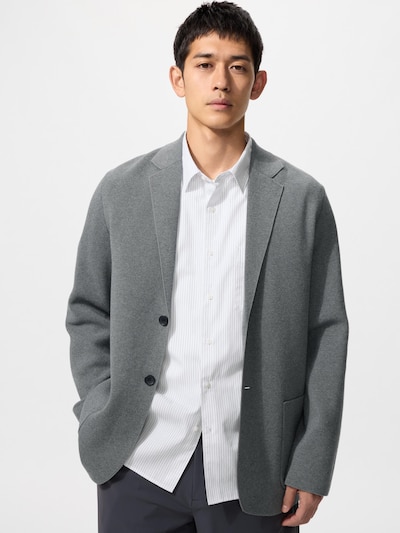 Male model wearing the Milano rib men's cotton jacket over a white shirt.