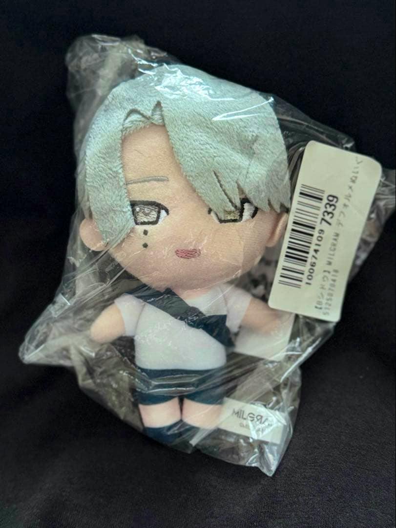 Sealed MILGRAM deformed plush toy of the character Shidou shown in its plastic packaging with a barcode label visible.