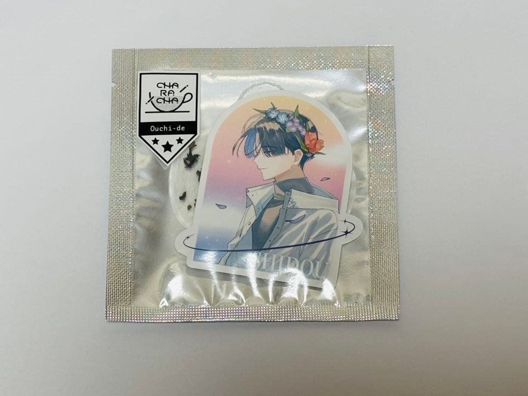 Front of a sealed tea bag pouch for MILGRAM ミルグラム シドウ black tea showing a character illustration on the package.