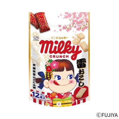 Front view of the packaged Milky Crunch rice crackers pouch showing the product branding and an illustrated girl on the bag.