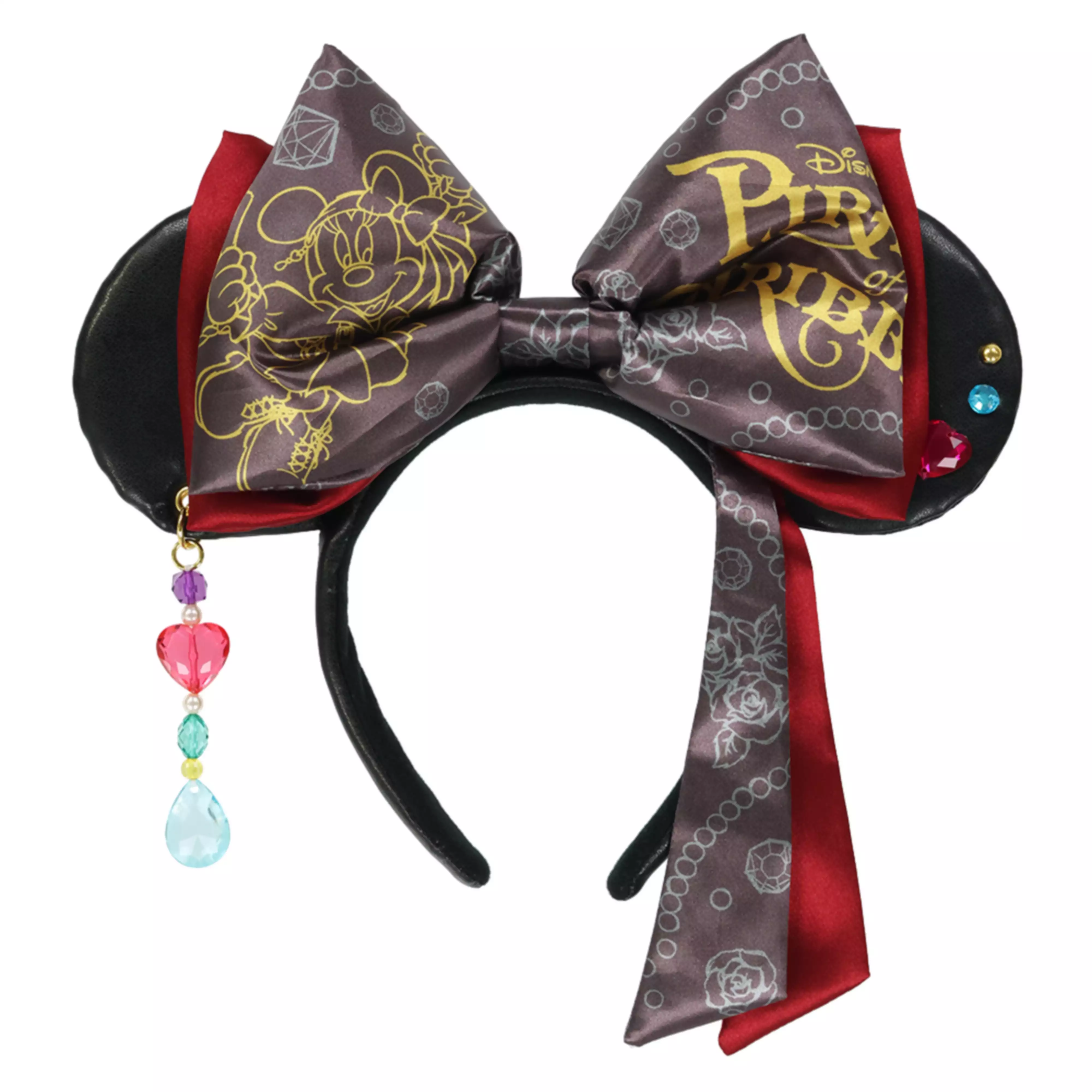 Front view of a Minnie-themed hair band with black ears, a large patterned bow, red ribbon tails, and a dangling beaded charm.