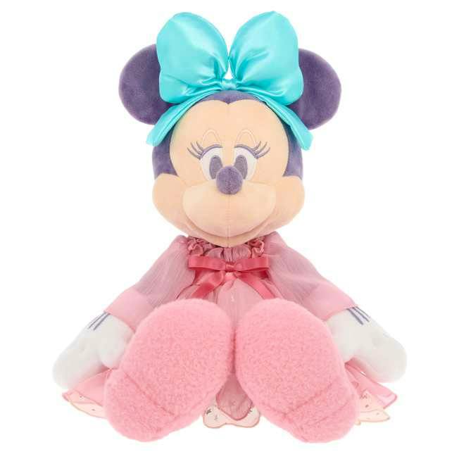 Front-facing plush Minnie Mouse wearing a large teal bow and a pink dress, seated on a white background.