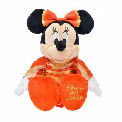 Front view of a Minnie Mouse plush wearing an orange kimono with "Disney store JAPAN" embroidered on its foot.