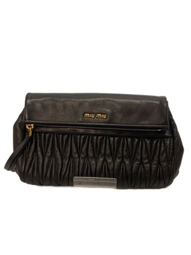 Black MIU MIU leather handbag with ruched front detailing and gold logo plaque shown against a white background.