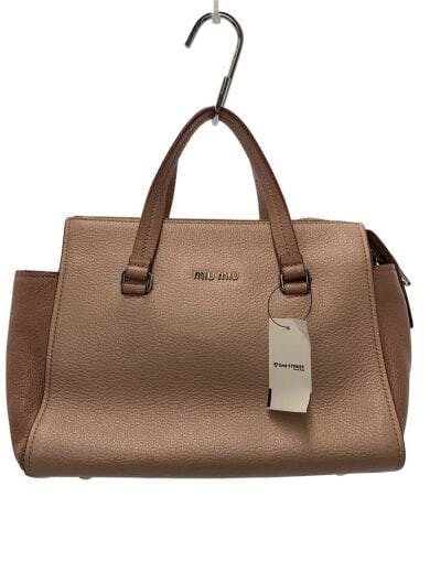 Front view of a pink MIU MIU leather shoulder bag hanging from a hook with a tag attached.