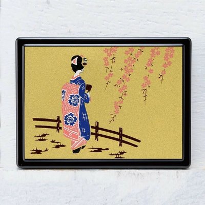 Rectangular wooden sticky-note case with a gold background decorated with a maiko in a blue and pink kimono and hanging cherry blossoms.