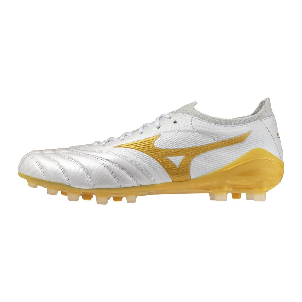 Side view of a white and gold soccer/football shoe showing the upper, laces, and gold outsole.