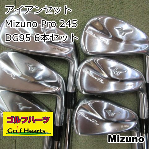 Six Mizuno Pro 245 golf iron heads arranged on a surface with overlaid Japanese text and a Golf Hearts logo.