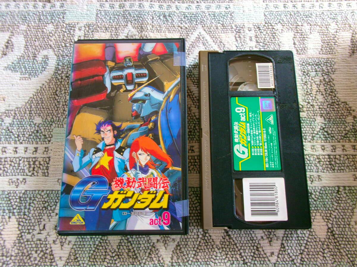 VHS cassette and its illustrated case for 機動武闘伝 Gガンダム act.9 displayed on a textured surface.