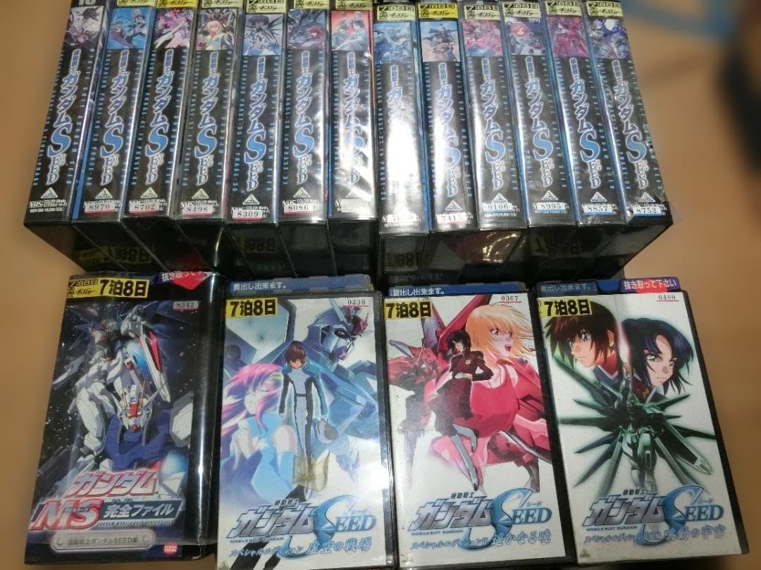 Rows of Mobile Suit Gundam SEED VHS tapes showing their spines and some front covers.