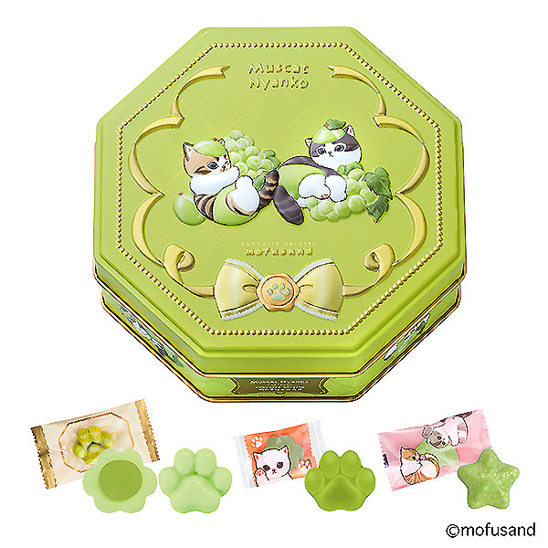 Green octagonal tin with cat illustrations shown alongside green muscat chocolates and their individual wrappers.