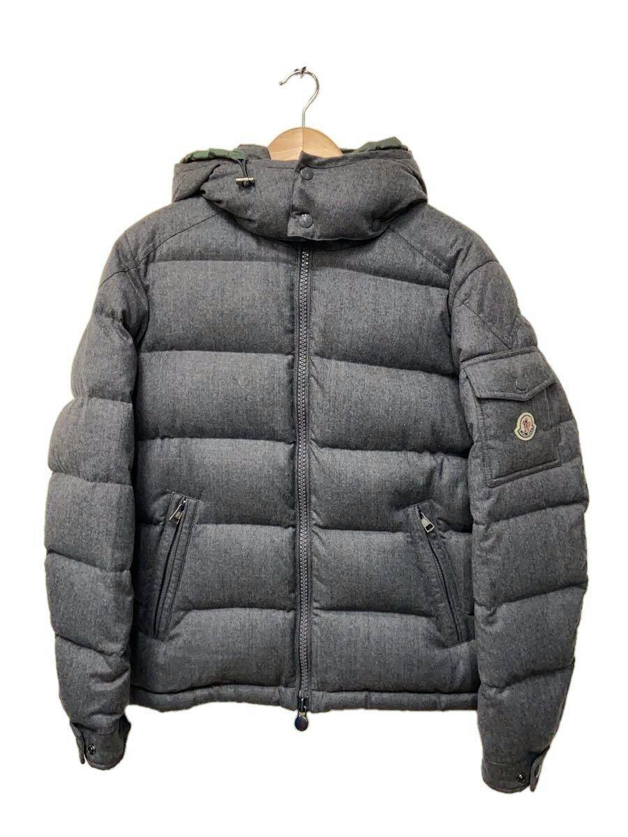 Front view of a gray Moncler men's wool down puffer jacket with hood hanging on a hanger.